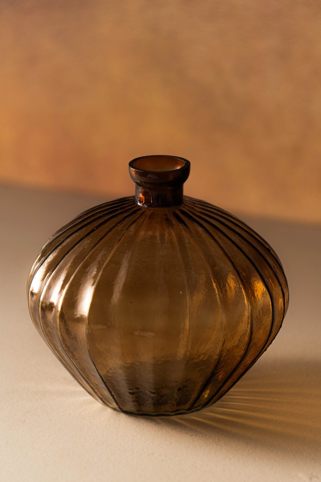 Genda Saaj Bloom Vase displayed with fresh flowers on wooden table