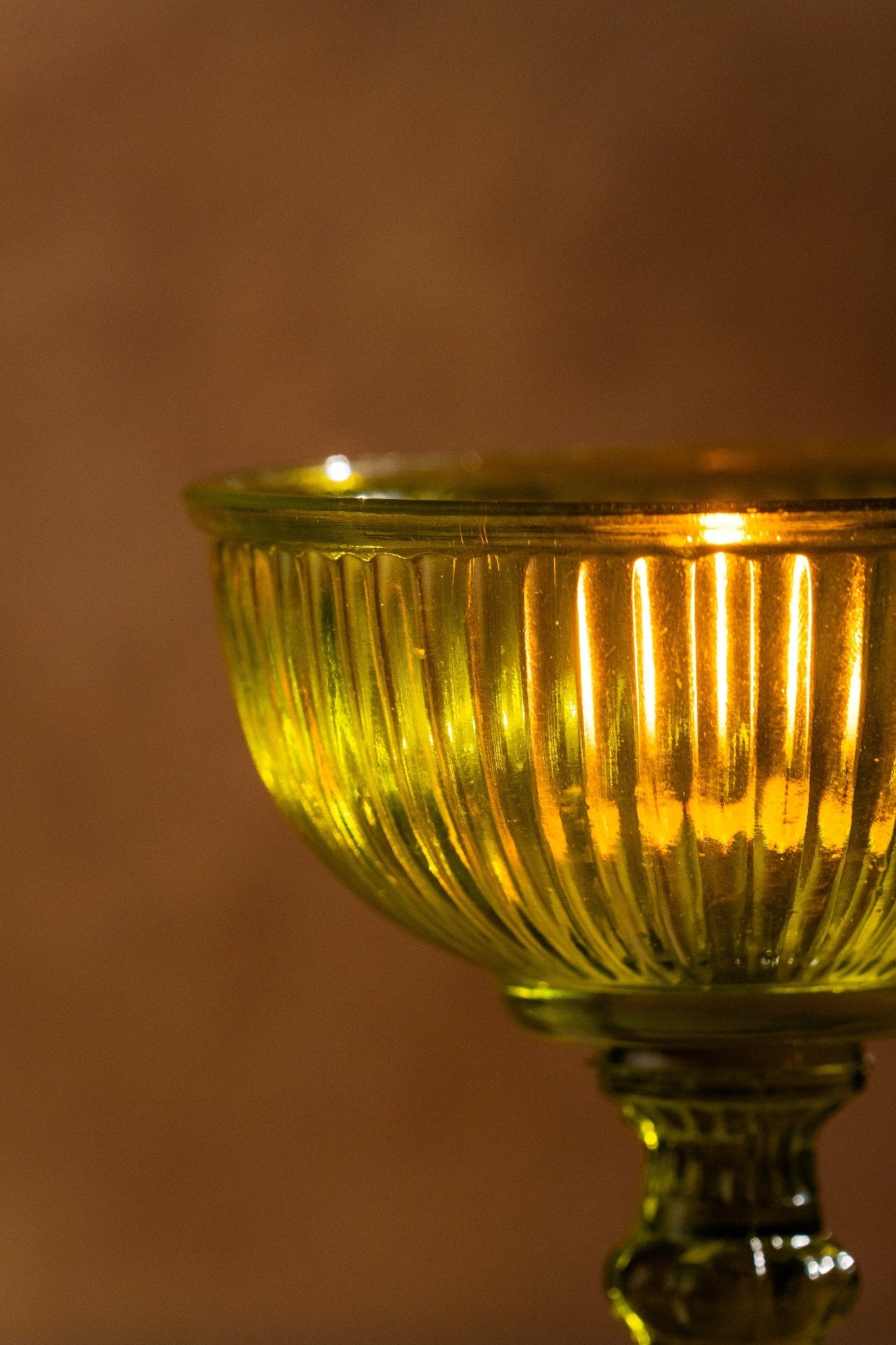 Side view of Genda Saaj candle holders displaying elegant glass construction and vibrant colors