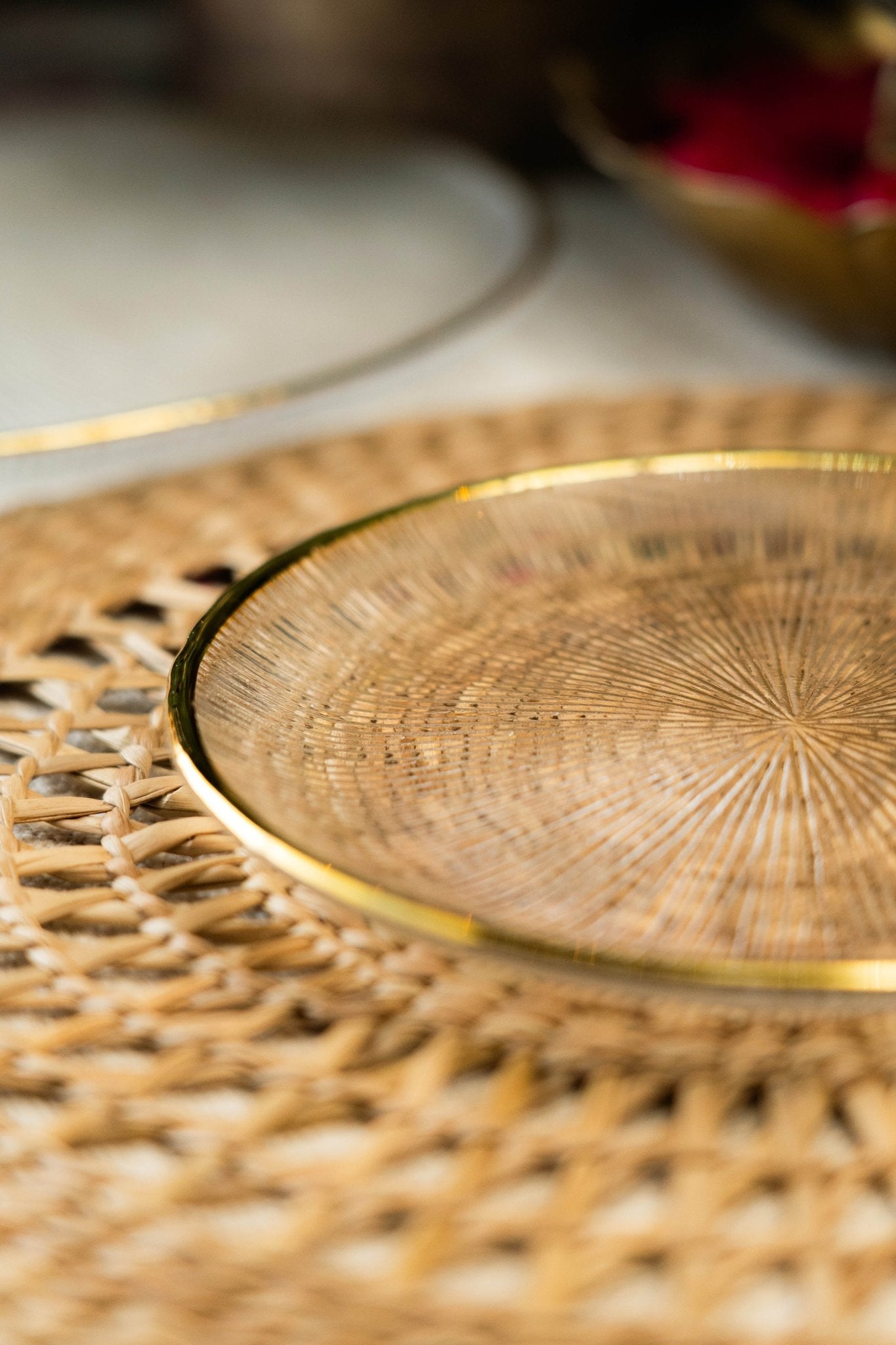 Gold decorative plate on a woven surface 