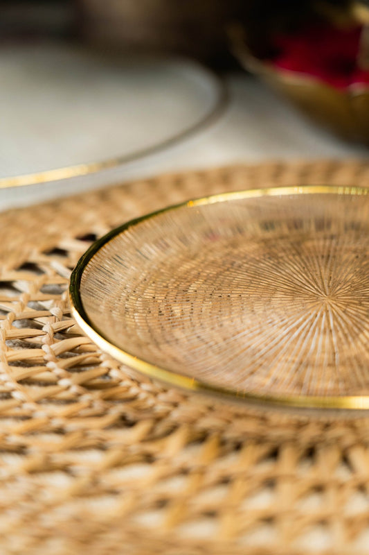 Gold decorative plate on a woven surface 