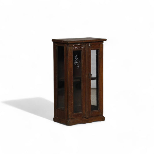 Wooden cabinet with glass doors on a white background