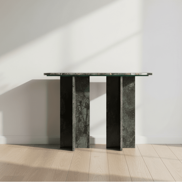 Console table with a glass top and dark marble base on a white background
