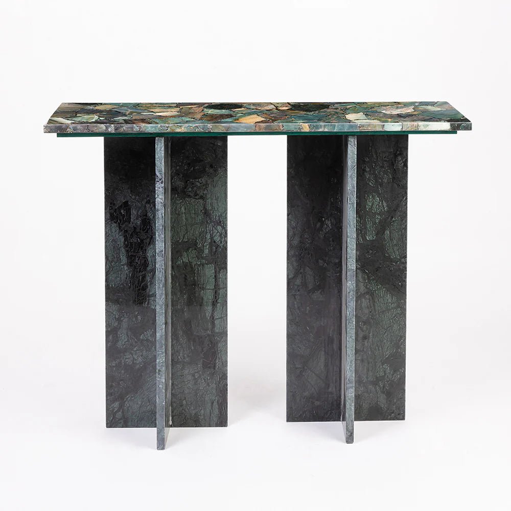 Table with green marble top and black marble legs on a white background