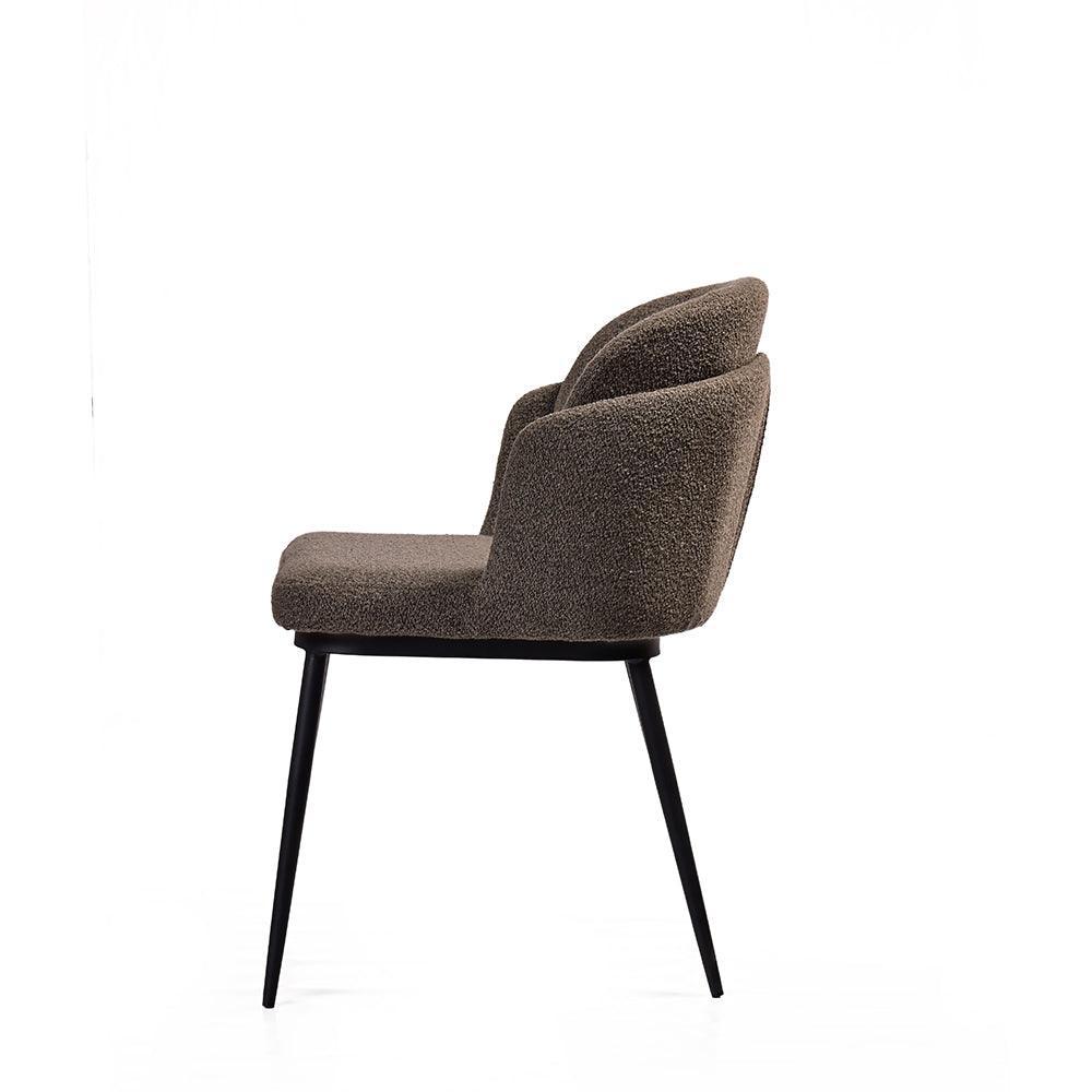 Brown upholstered chair with black legs on a white background