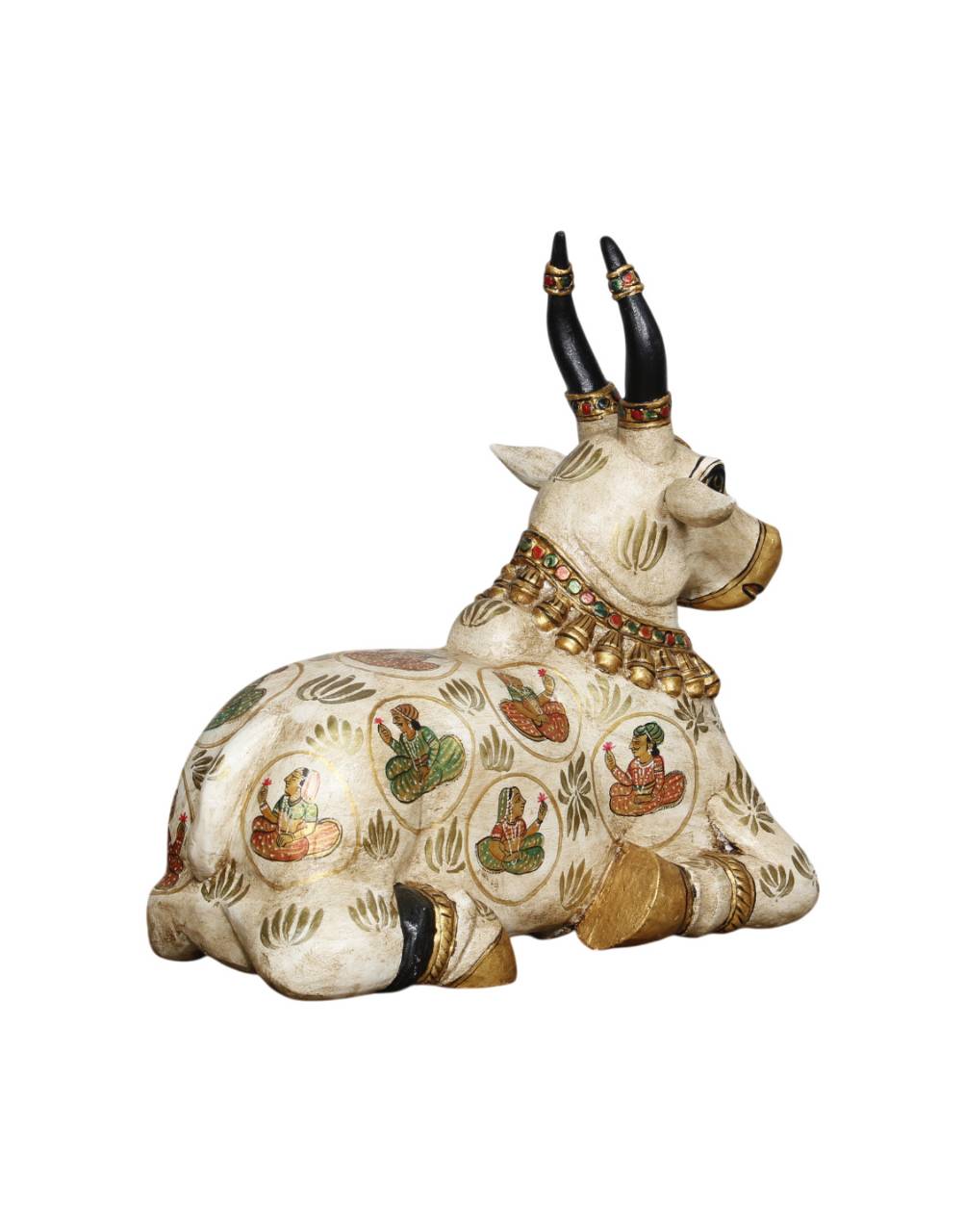 Decorative figurine of a bull with intricate designs on a white background
