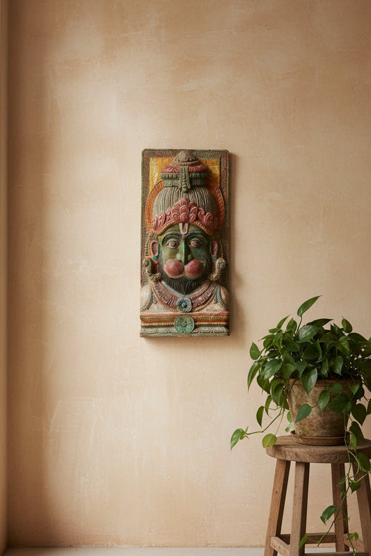 Decorative wall panel with a face design on a white background