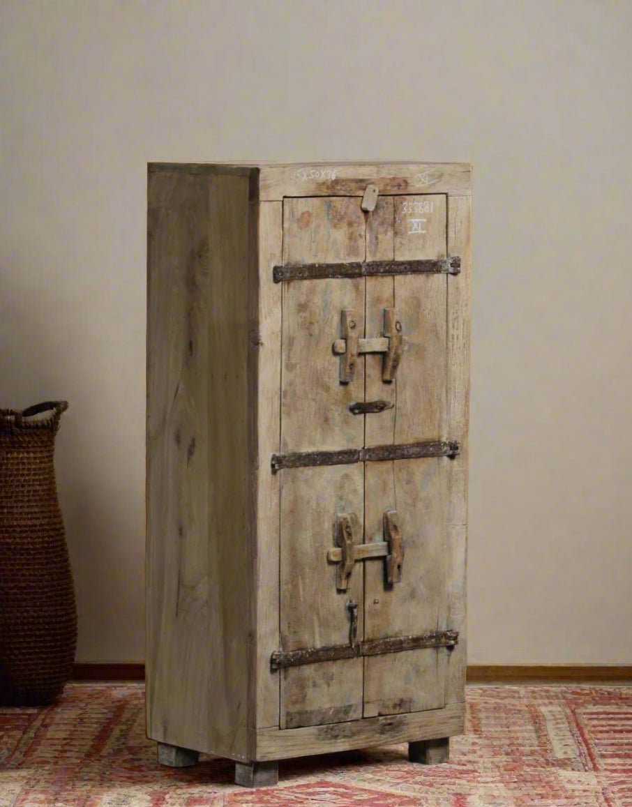 Vintage wooden cabinet with metal locks on a neutral background