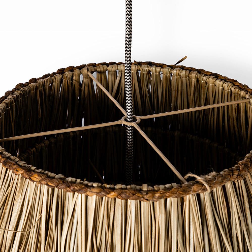 Close-up of a woven lampshade with a white background