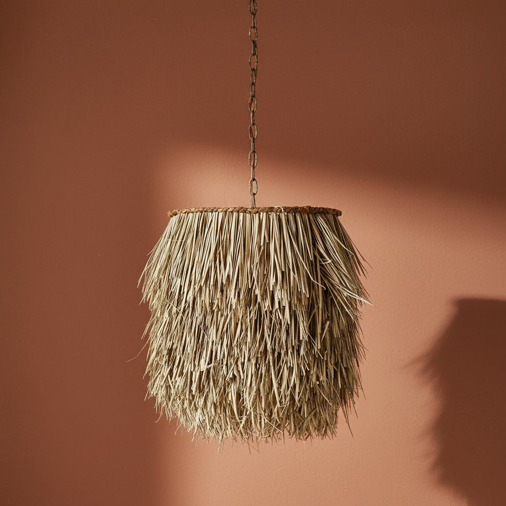 Rattan pendant light hanging against a brown background