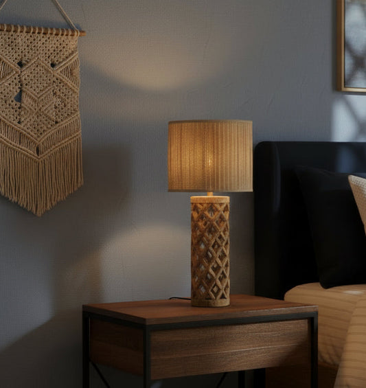 Decorative lamp with wicker design on a table in a living room setting.