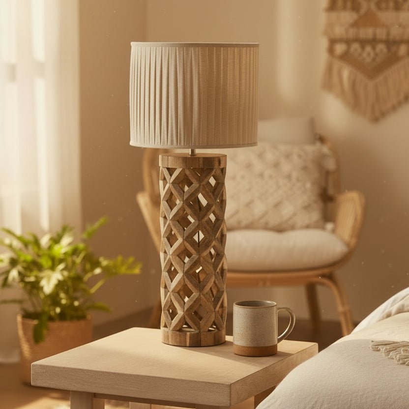 Wooden lamp with pleated shade on a table in a cozy living room.