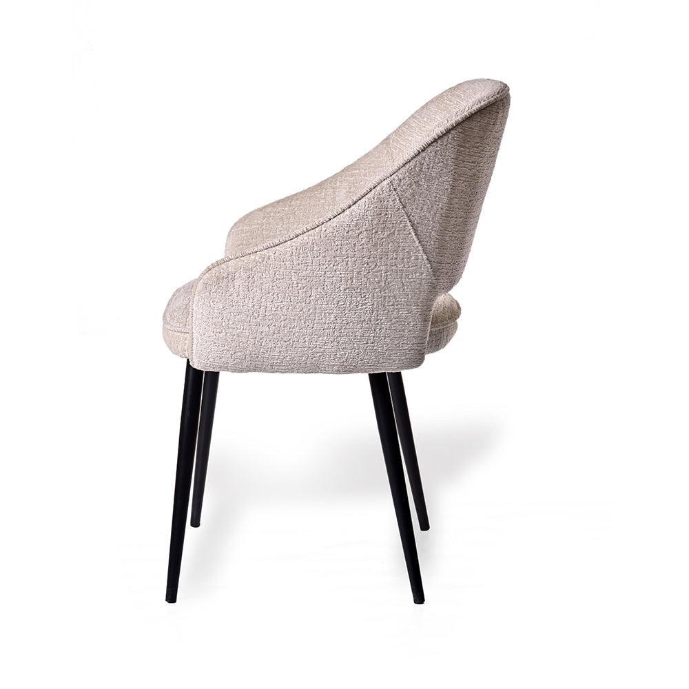 Beige upholstered chair with black legs on a white background