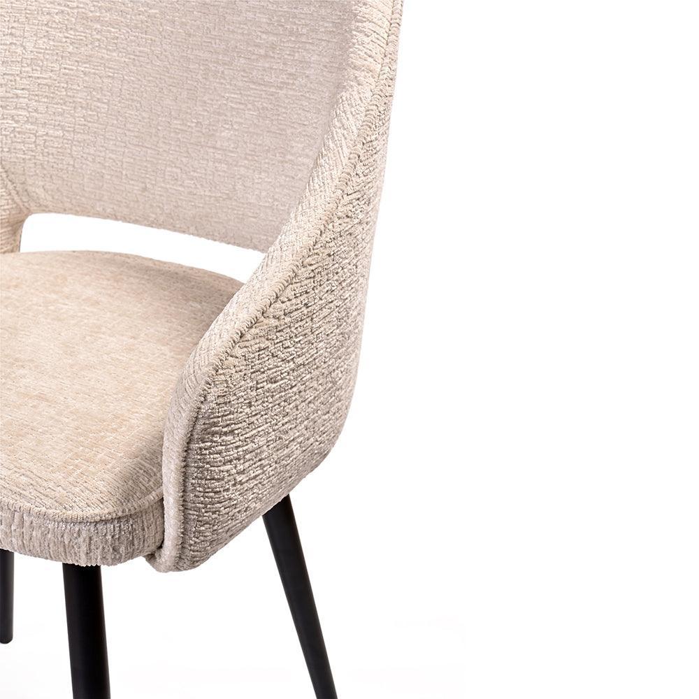 Beige textured chair with black legs on a white background