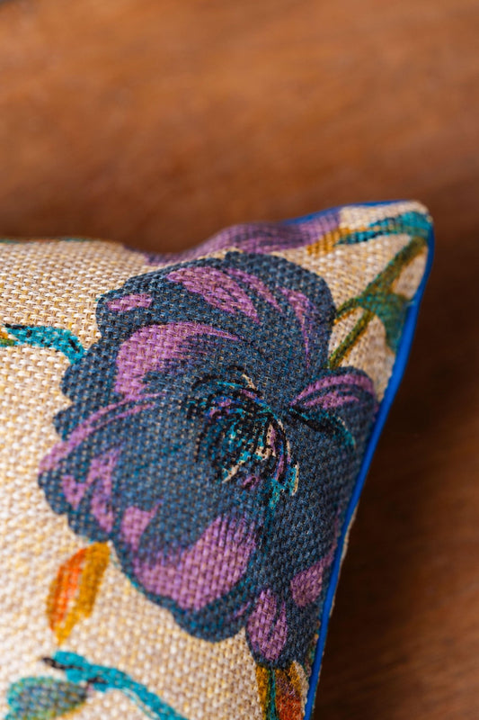 Close-up of vibrant turquoise floral embroidery on jute weave cushion cover – Tesu Cushion Covers