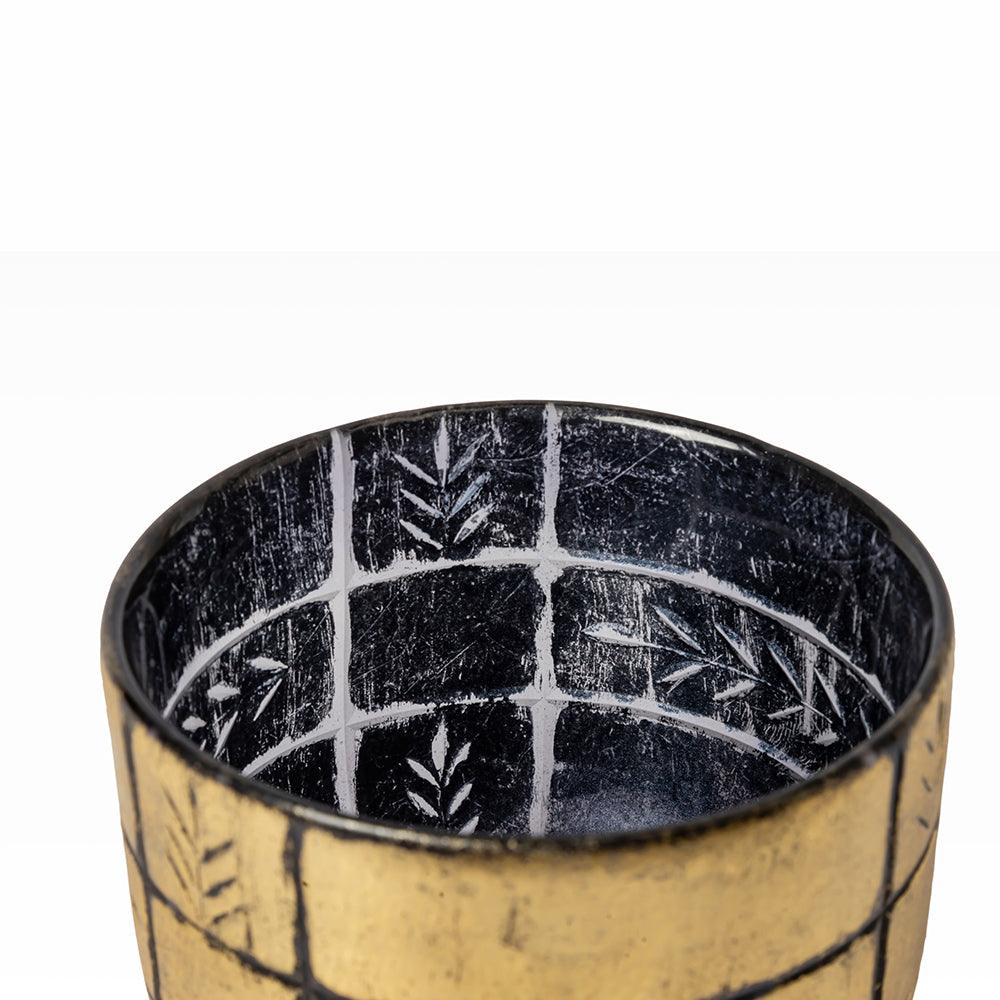 Designed to blend luxury and warmth, this golden-toned vessel features intricate etching and a lustrous finish that reflects candlelight beautifully.