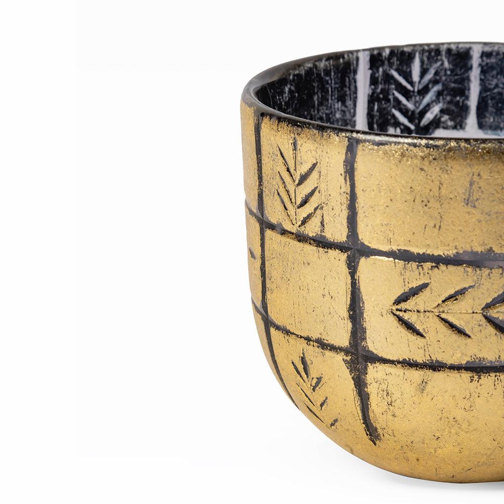 Ceramic bowl with black geometric patterns on a white background