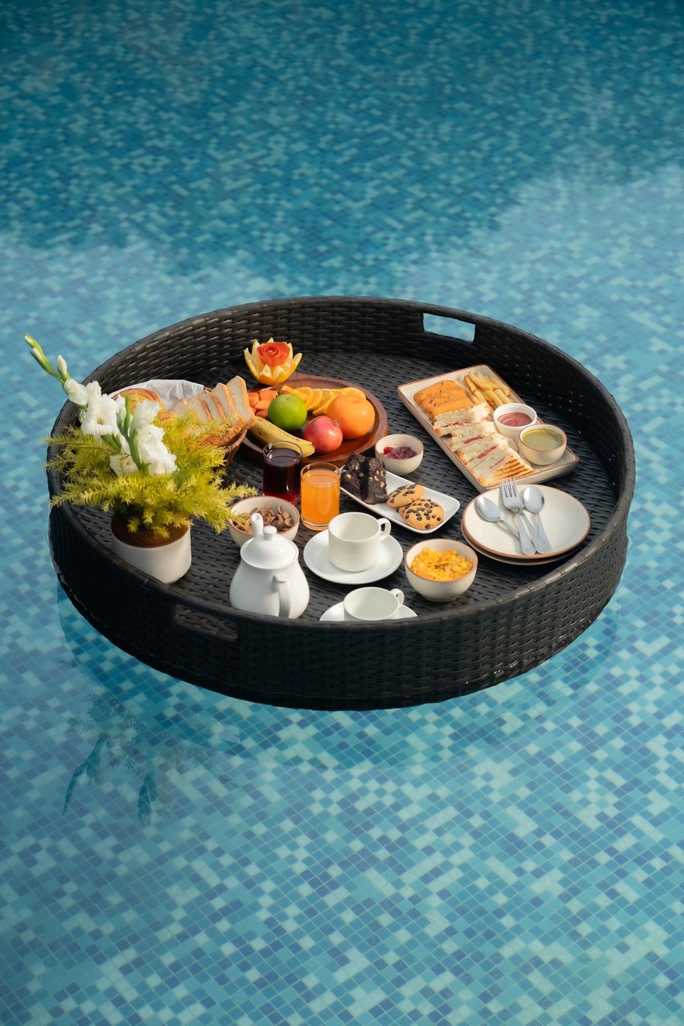 Luxury Round Floating Serving Tray with breakfast setup floating in pool - handwoven synthetic rattan waterproof.
