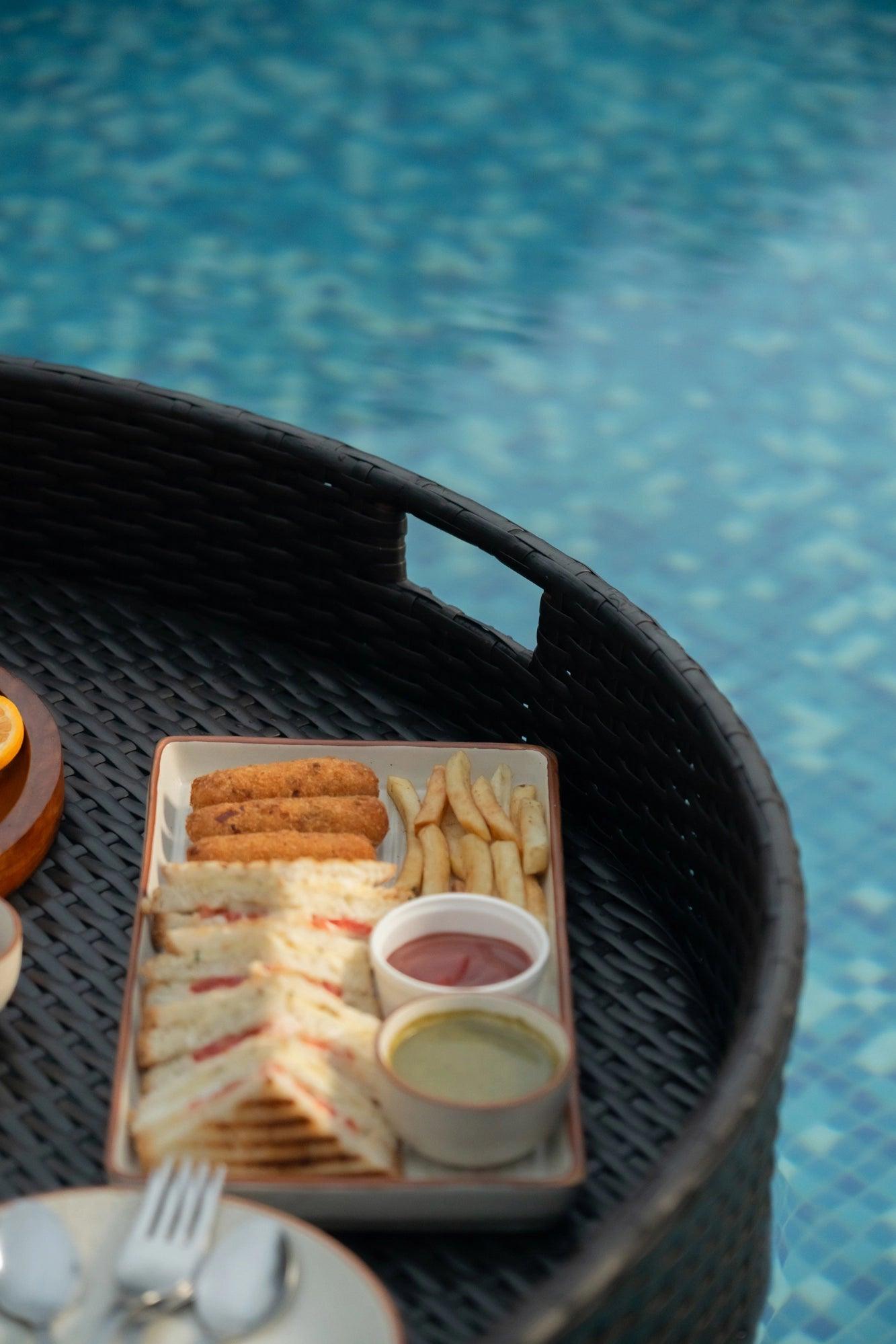 Luxury Round Floating Serving Tray detail view - handcrafted synthetic rattan with aluminum frame and parachute canopy lining