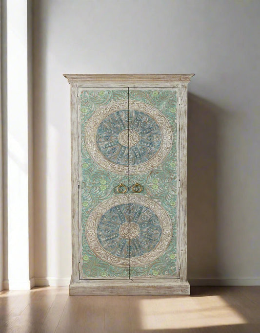Decorative cabinet with intricate designs on a white background