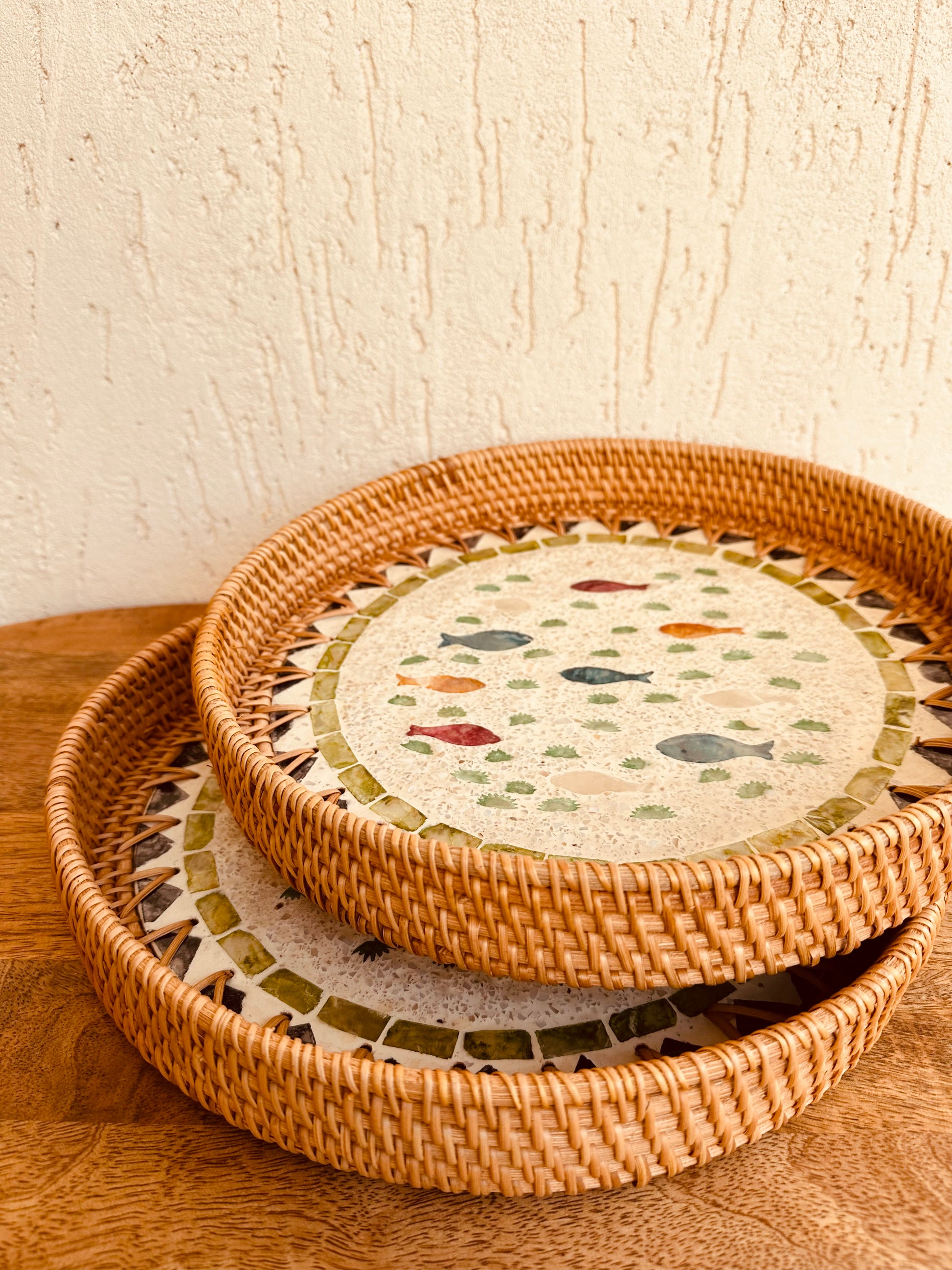 Enhance your Dream Home with our curated selection of premium Home Décor items. Round Mother Of Pearl Rattan Tray is made with handwoven rattan material mixed mother of pearl Impress your guests with these beautiful hand woven serving trays made with natural Rattan. In effortlessly chic hand-woven round tray has a designer motifs on it which makes it a center of attraction. TESU