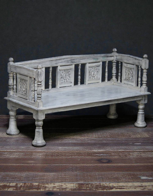 Ornate garden bench inspired by Mughal design, featuring intricately carved details and elegant craftsmanship, placed in an outdoor setting with a regal and timeless aesthetic.