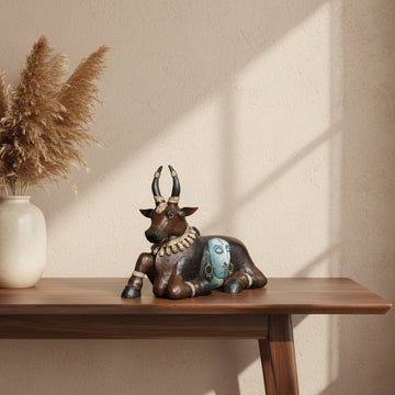 Bring home the divine energy of Nandi, the sacred bull and devoted guardian of Lord Shiva, in this exquisitely handcrafted sculpture. 