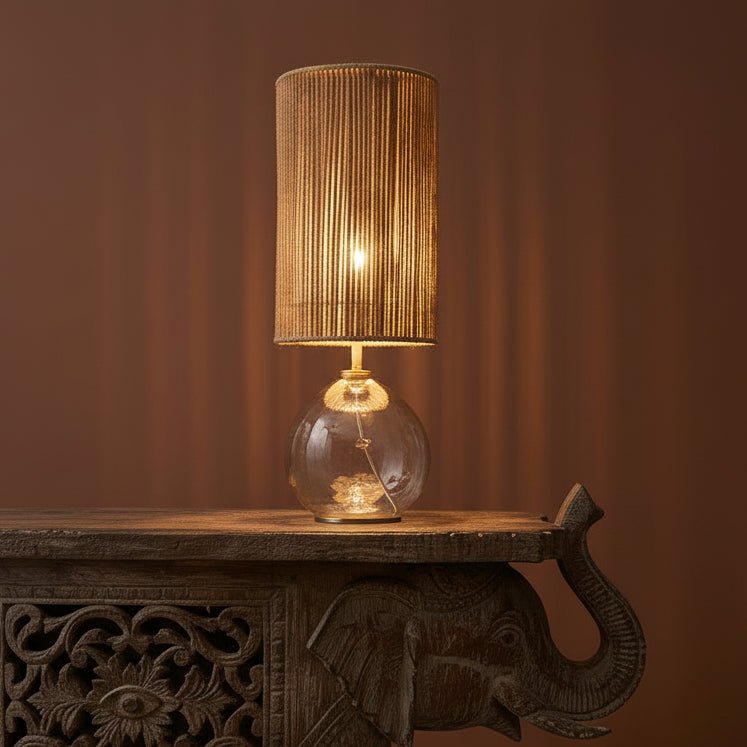 Decorative elephant table with a lamp in a room with a warm color scheme.