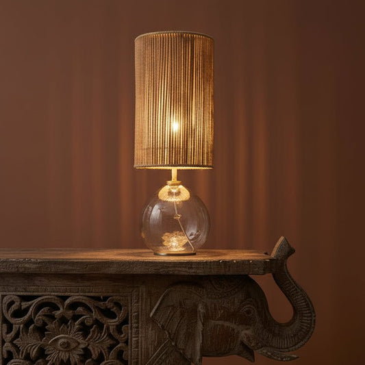 Decorative elephant table with a lamp in a room with a warm color scheme.