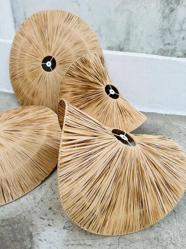 Set of four natural woven bags on a stone surface with a marble background