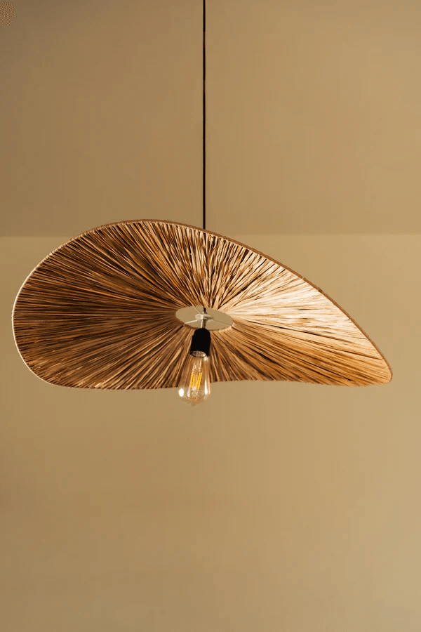 Wooden pendant light fixture on a beige background