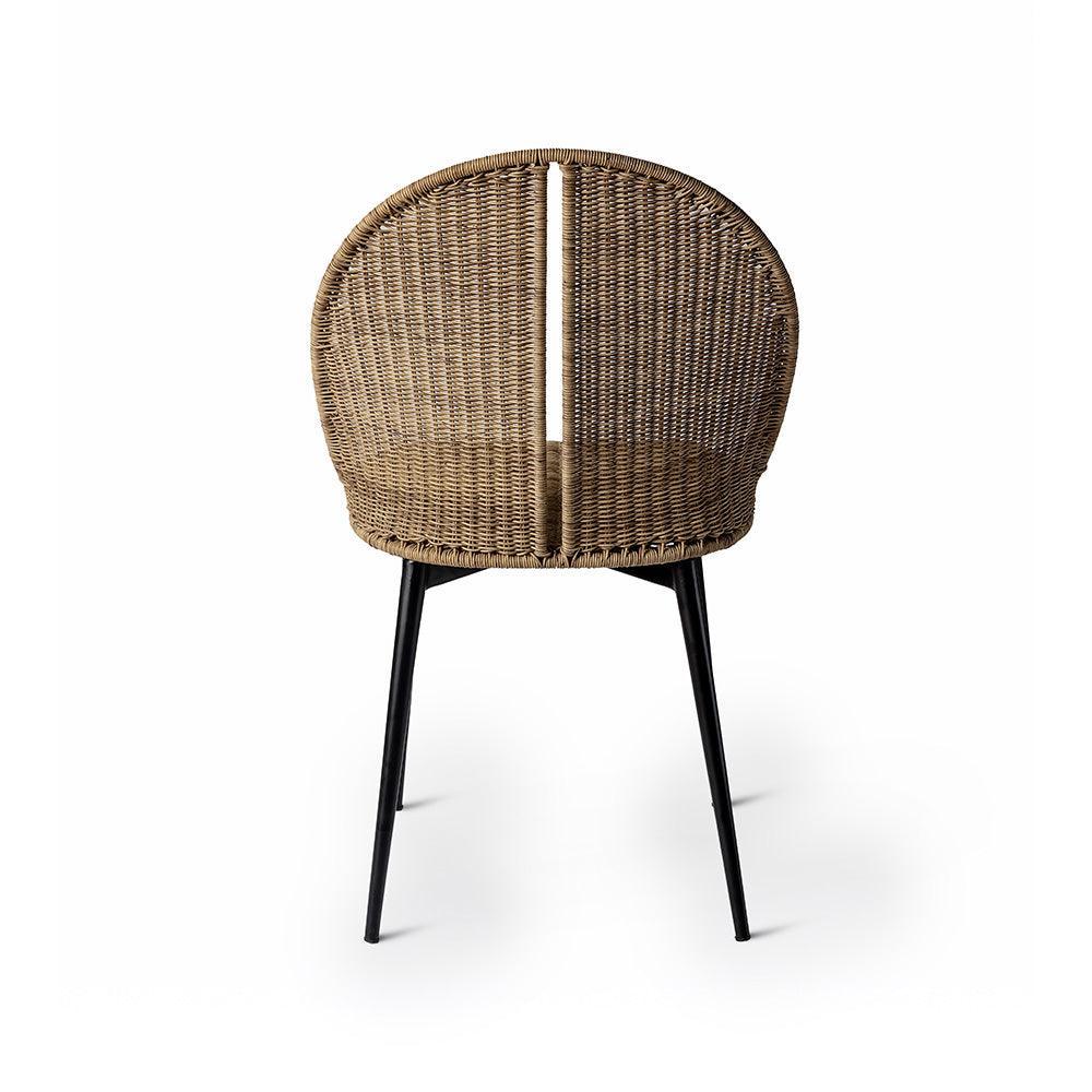 Wicker chair with black legs on a white background