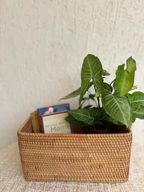 Side view of sustainable rattan organizer showing secure lid closure and natural rustic elegance
