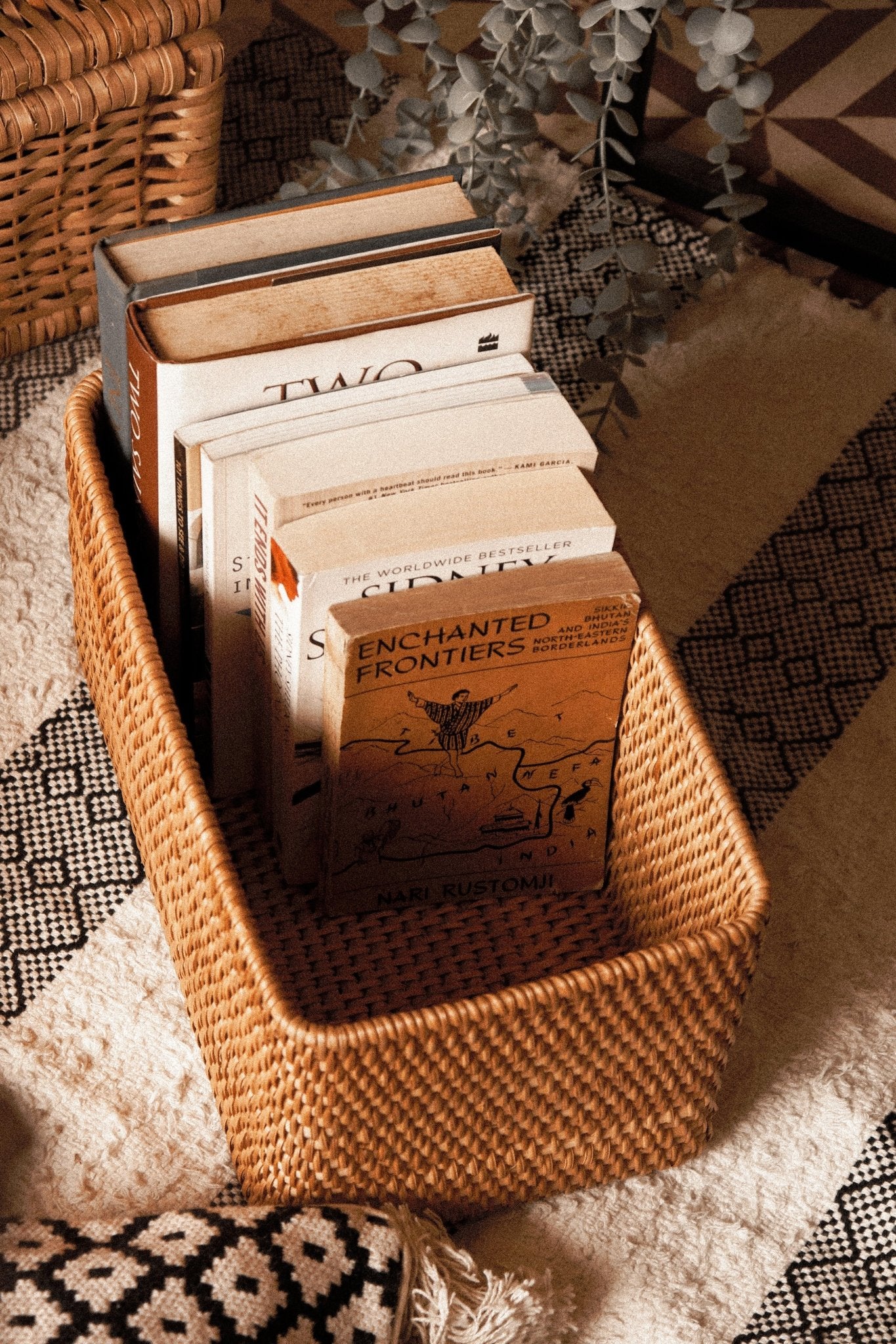 Rattan box with lid open displaying interior storage space for keepsakes and home organization