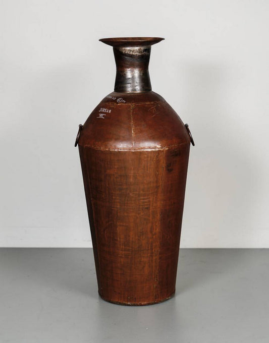 Vintage leather container with metal top on a plain background