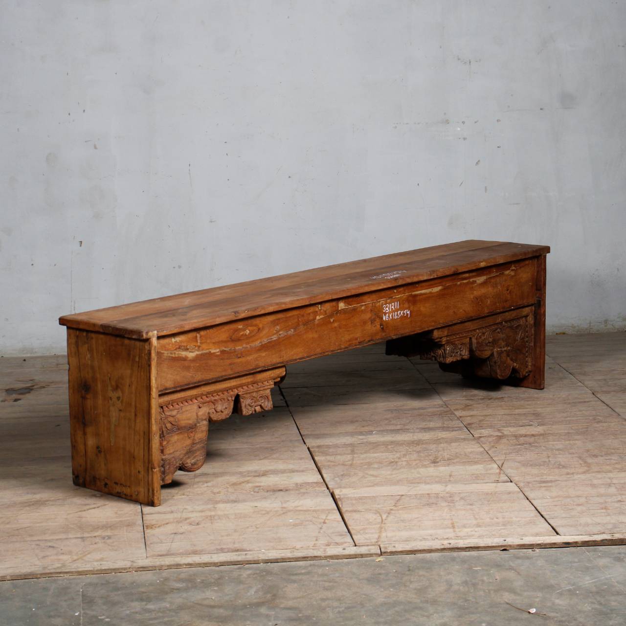 Handcrafted reclaimed wood bench with a rustic natural finish, featuring a sturdy rectangular seat, thick block legs, and visible wood grain that highlights sustainable craftsmanship.