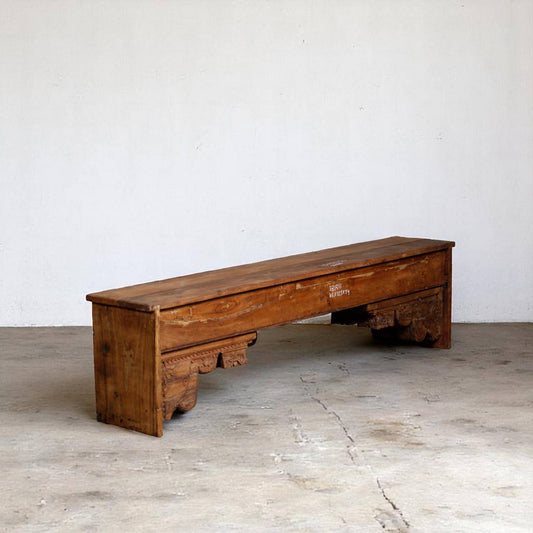 Handcrafted reclaimed wood bench with a rustic natural finish, featuring a sturdy rectangular seat, thick block legs, and visible wood grain that highlights sustainable craftsmanship.