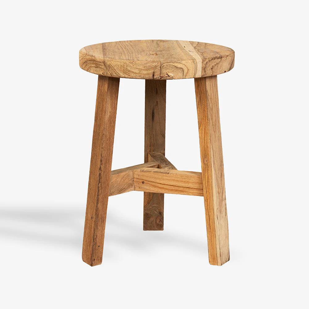 Wooden stool with a round top on a white background