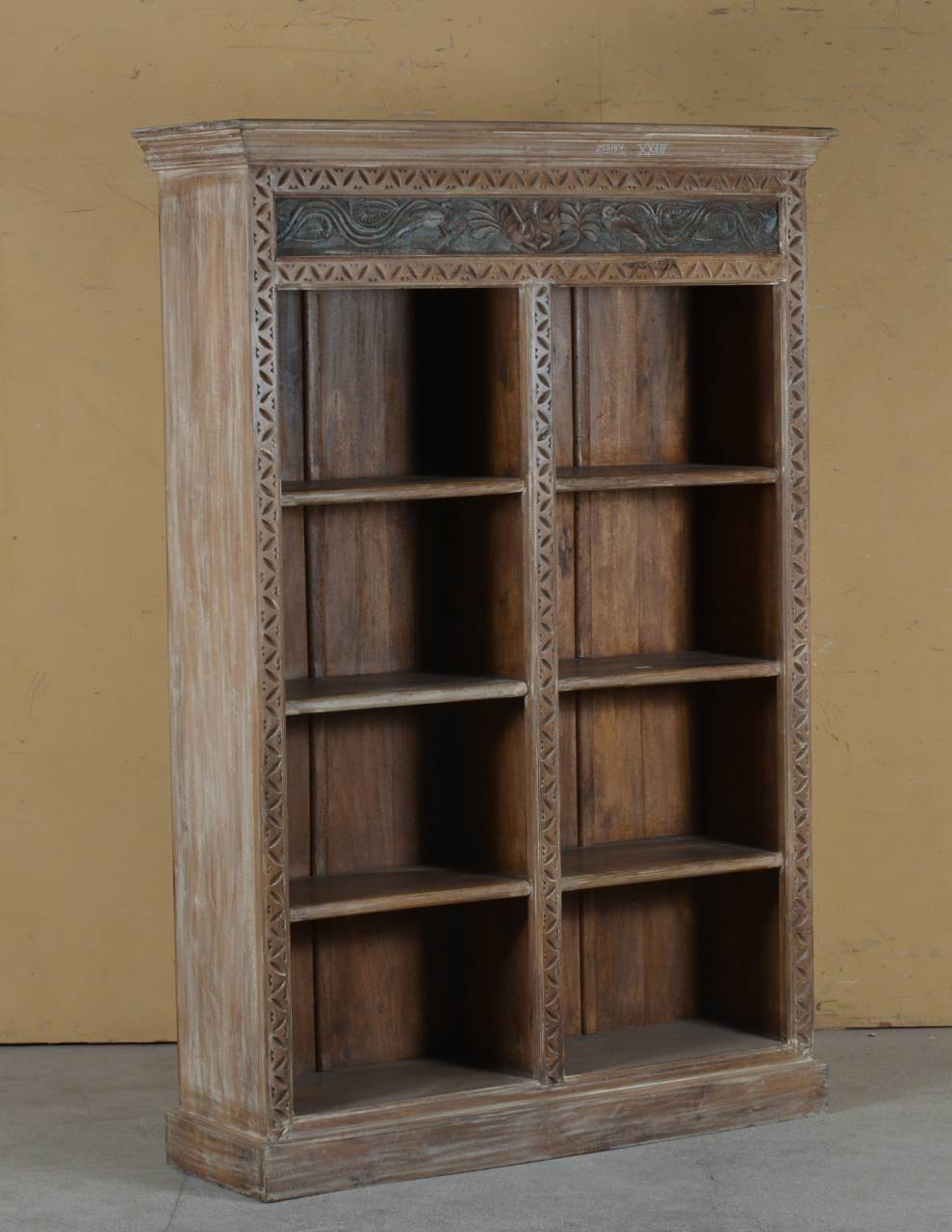 Wooden bookshelf with intricate carvings 