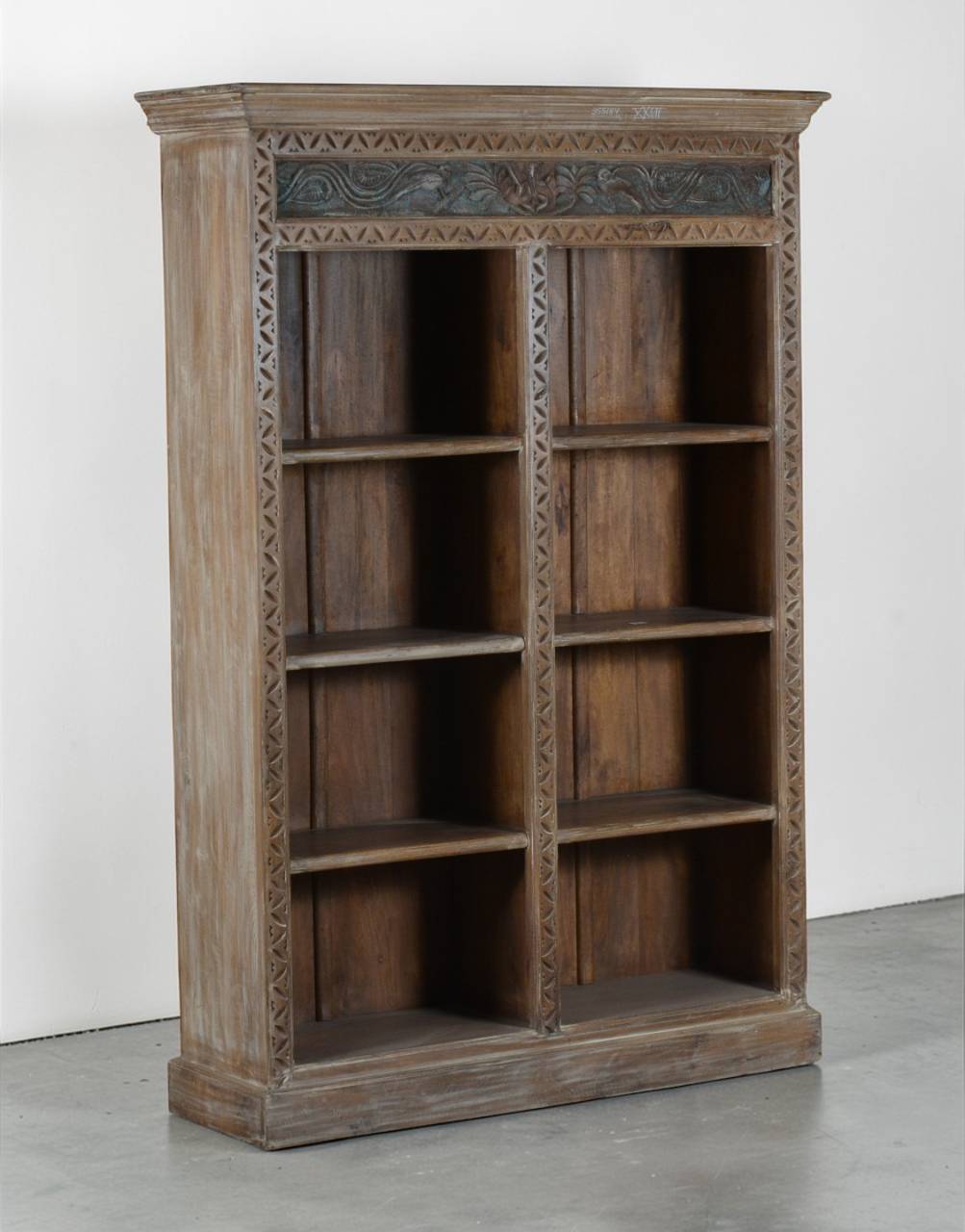 Wooden bookshelf with intricate carvings