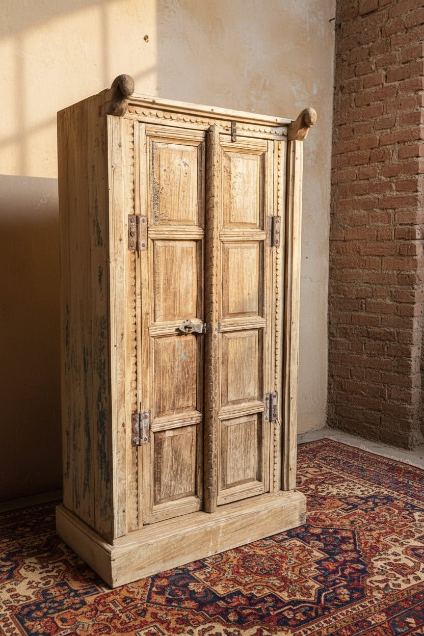 Vintage wooden wardrobe with double doors in a rustic setting