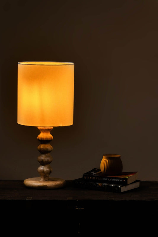 Handcrafted sculpted wood table lamp with natural wooden base and white fabric shade, 21 inches tall