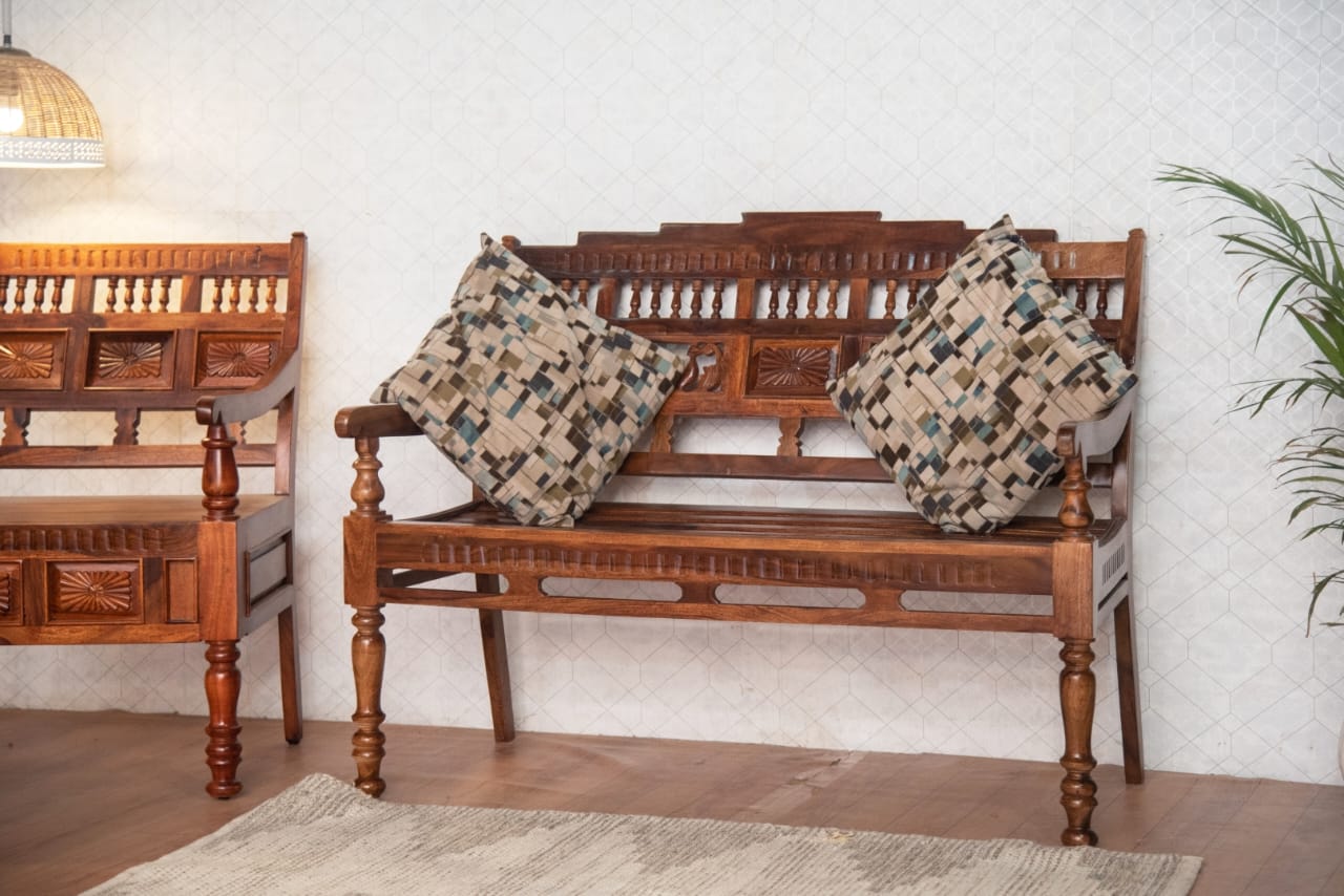 Wooden bench with patterned cushions in a room setting