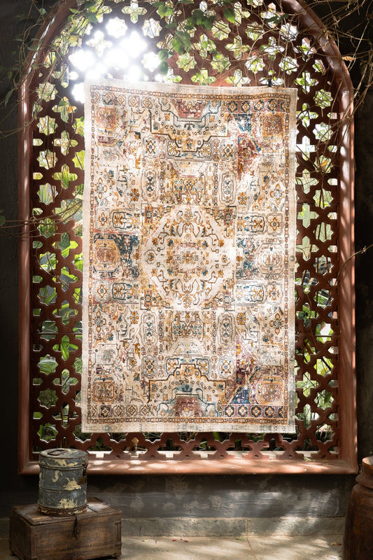 Decorative rug with intricate patterns displayed behind a decorative wooden screen.