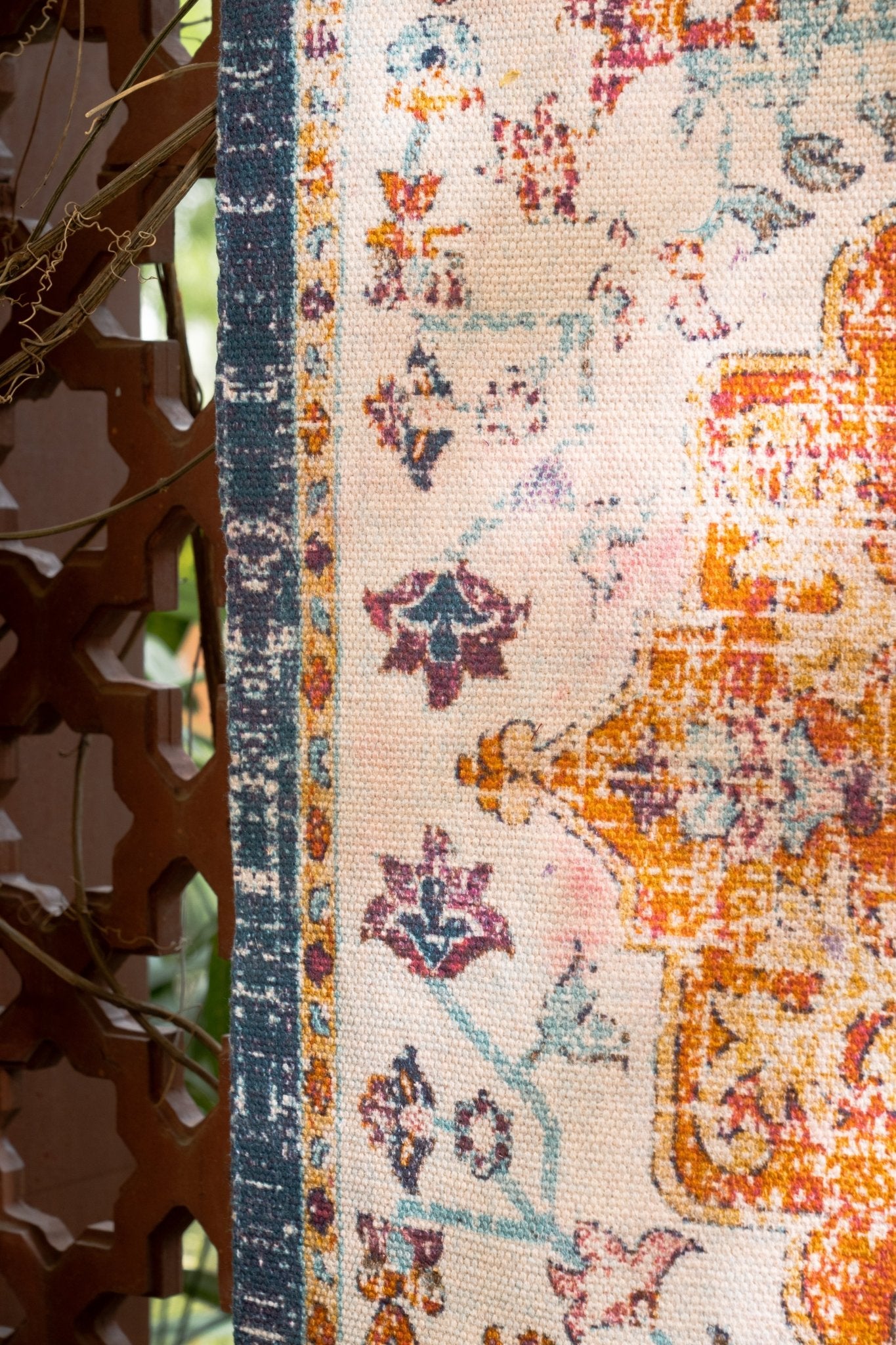 Close-up of a patterned rug with vibrant colors and intricate designs.