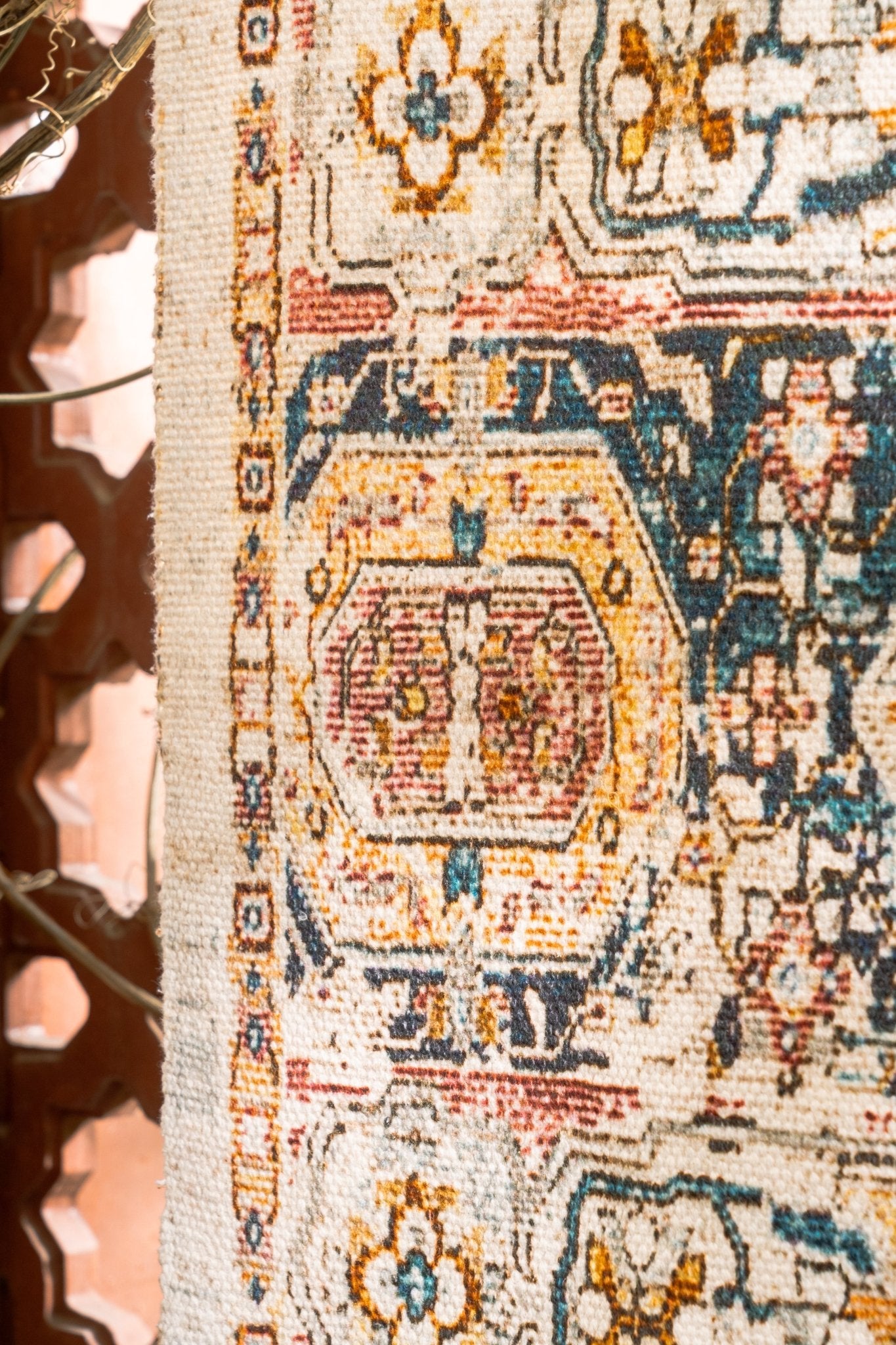 Close-up of an ornate rug with intricate patterns and colors.