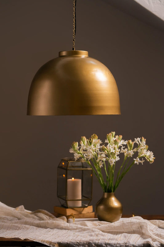 Side view of Swarna round brass pendant lamp showing circular shade and chain – Tesu Lamps & Lighting