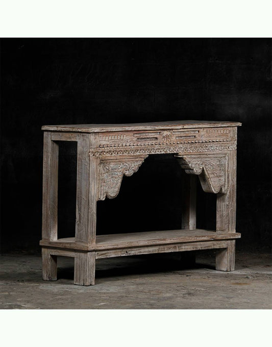 Antique Console Table with Carving Vintage-inspired design Hand-carved details Rare and unique piece 100% solid wood construction Skilled artisan craftsmanship Environmentally friendly Sustainable furniture Preserved and protected over the years Imperfections add character Uneven planks Knots and warping Cracks and splits Filled with wood fillers Enhancements to the collection Timeless beauty Functional art Statement furniture Eco-friendly decor Handcrafted elegance. TESU