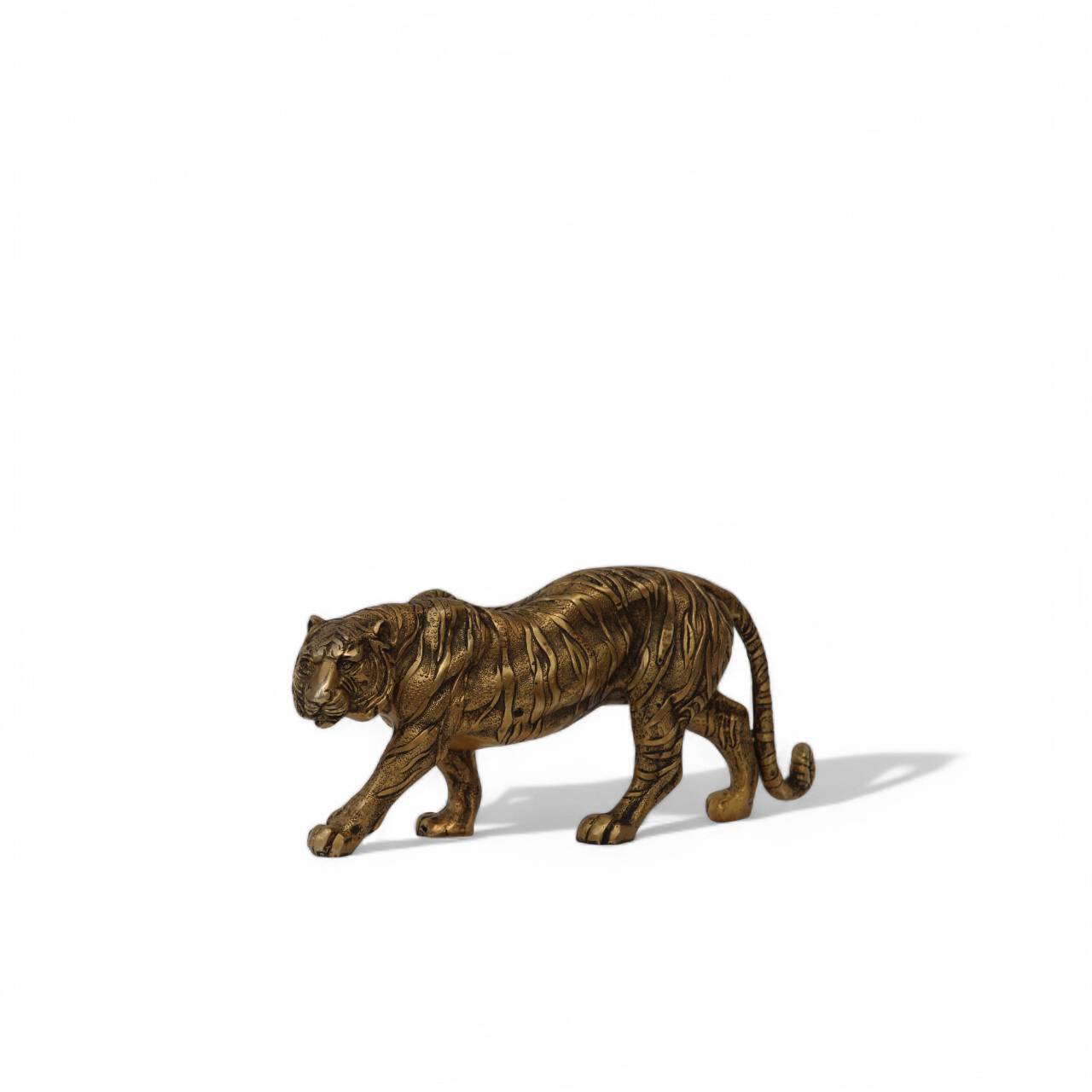 Handcrafted Bengal Brass Tiger by Tesu, featuring intricate detailing and a majestic stance, symbolizing strength and elegance in home deco