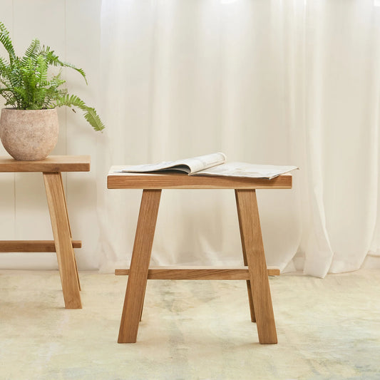 The Timber Rectangle Stool is a versatile and stylish piece of furniture that can serve both functional and decorative purposes in a variety of home settings. 