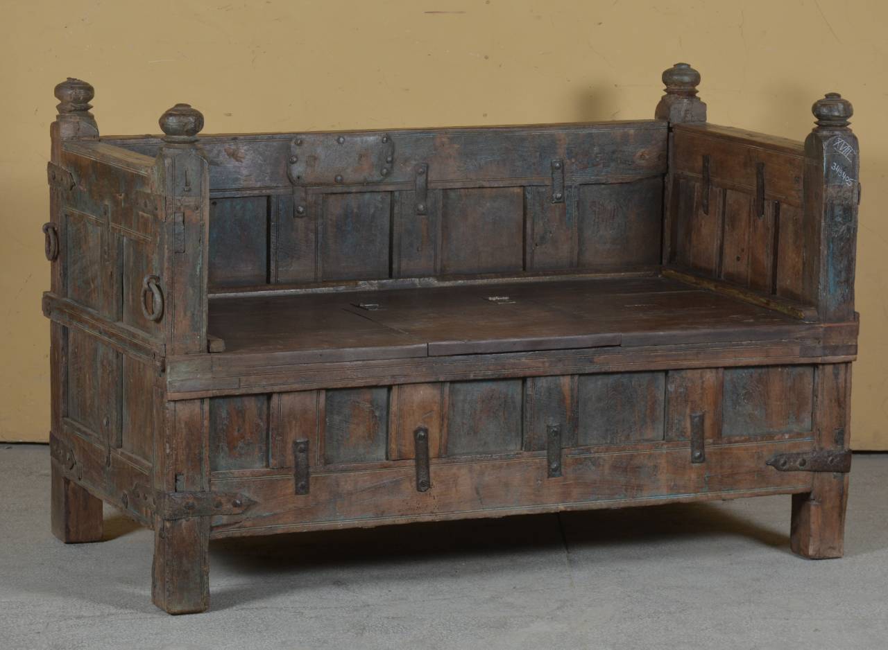 Vintage wooden bench with a rustic design against a plain background